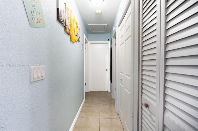 hallway featuring light tile patterned floors