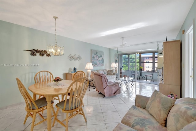 dining area with light tile patterned floors and ceiling fan with notable chandelier