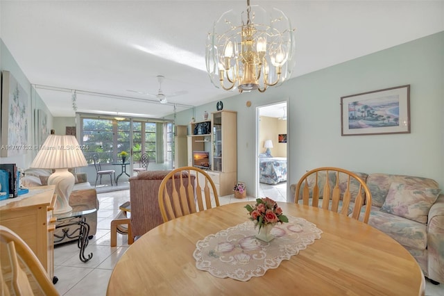 tiled dining space with ceiling fan