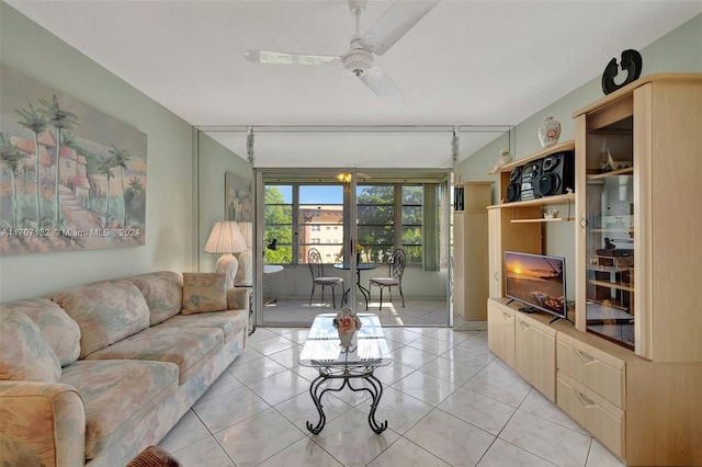 living room featuring light tile patterned floors and ceiling fan