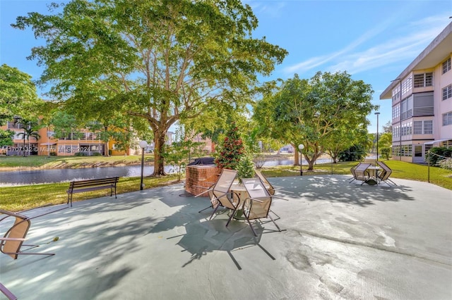 view of patio with a water view