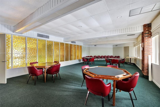 playroom with carpet flooring and a drop ceiling