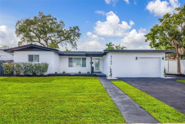 ranch-style house with a front lawn and a garage