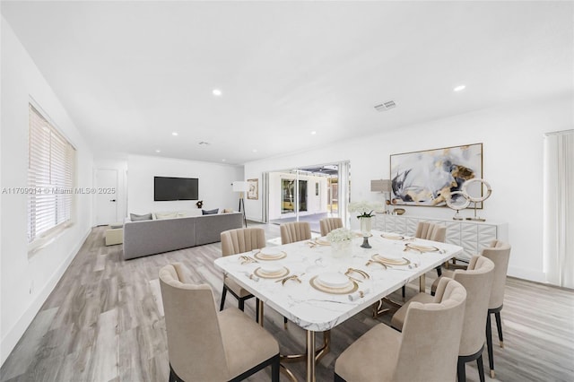 dining area with light hardwood / wood-style floors