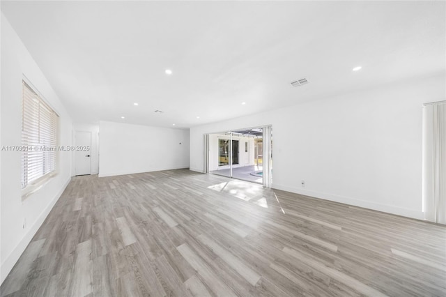 unfurnished living room with light hardwood / wood-style flooring