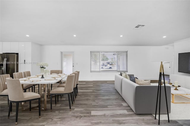 dining area with hardwood / wood-style flooring