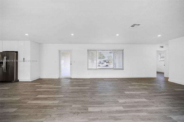 unfurnished living room with light hardwood / wood-style floors