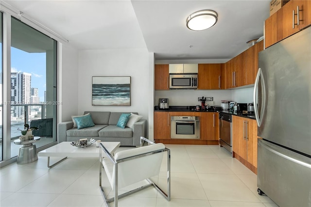 kitchen featuring appliances with stainless steel finishes and light tile patterned flooring