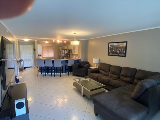 tiled living room featuring crown molding