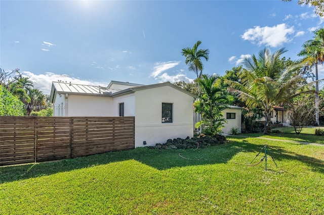 view of property exterior featuring a yard