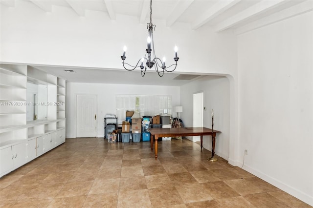 dining area with built in shelves, beamed ceiling, and a chandelier