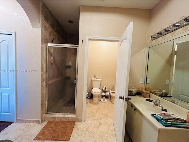 full bathroom featuring toilet, a stall shower, and vanity