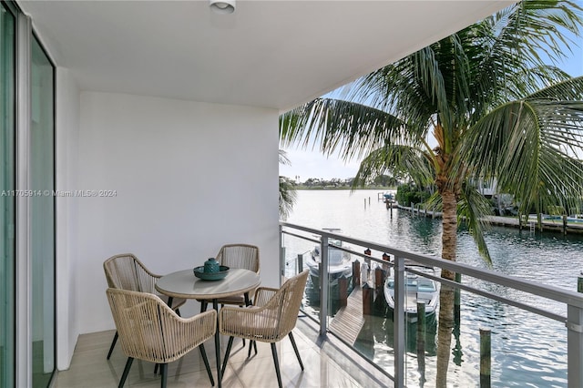 balcony featuring a water view