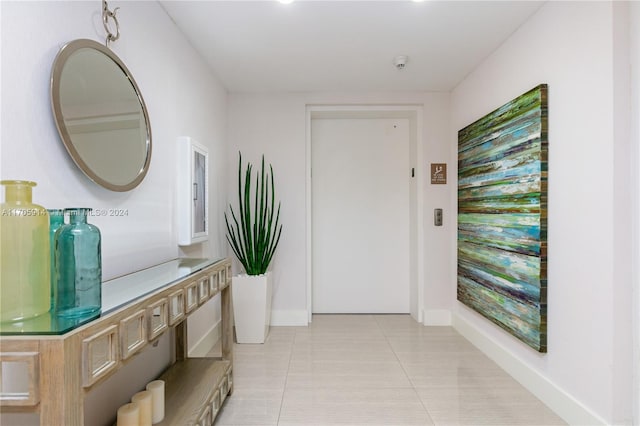 interior space with light tile patterned floors