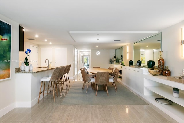 tiled dining space with sink