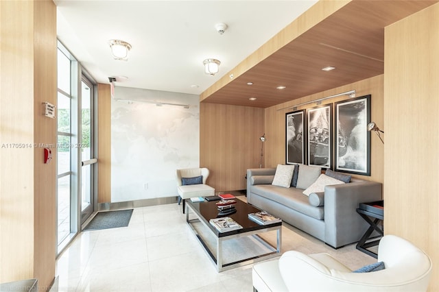 living room featuring expansive windows and wooden ceiling