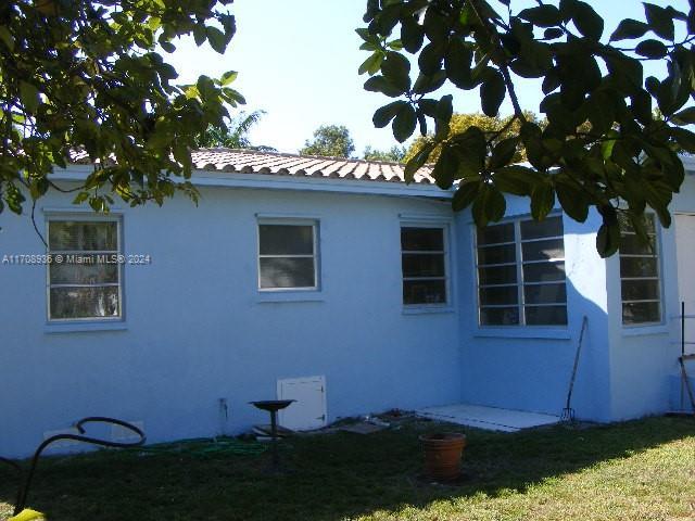 view of home's exterior with a yard