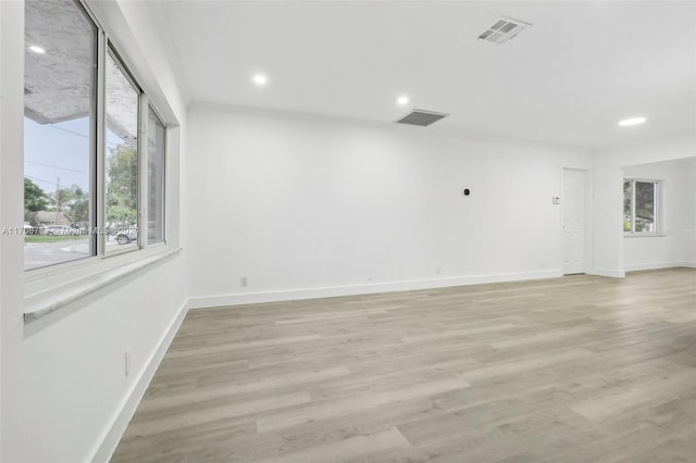 unfurnished room featuring light hardwood / wood-style floors