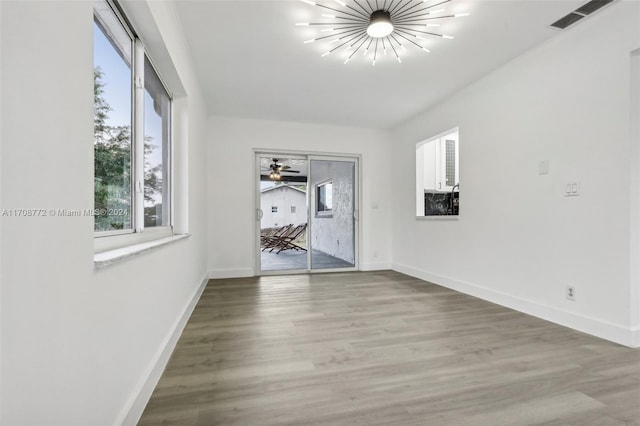 empty room featuring ceiling fan and wood-type flooring