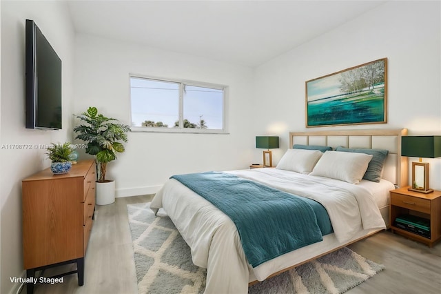 bedroom featuring light hardwood / wood-style floors