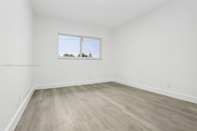 unfurnished room with light hardwood / wood-style floors