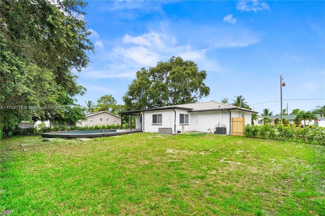 524 NW 7th Ct, Boynton Beach, FL 33426 - rear view of house featuring an outdoor pool and stucco siding