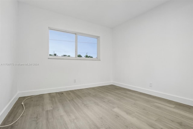 spare room featuring light hardwood / wood-style flooring