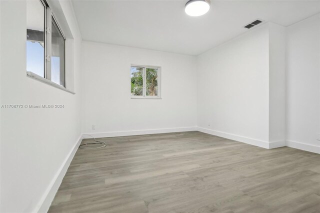 empty room featuring wood-type flooring