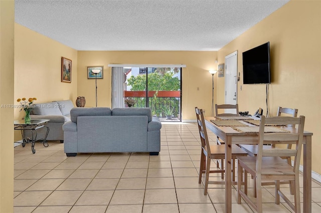 tiled living room with a textured ceiling