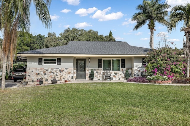 ranch-style house with a front yard and a porch