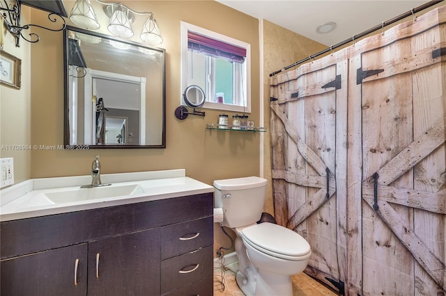 full bathroom with toilet, a shower with shower curtain, and vanity