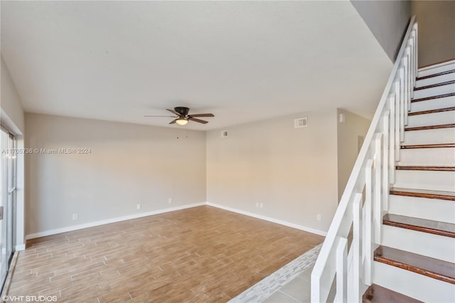 interior space featuring hardwood / wood-style flooring and ceiling fan