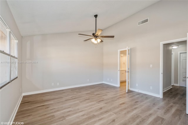 unfurnished room featuring light wood-type flooring, high vaulted ceiling, ceiling fan, and a healthy amount of sunlight