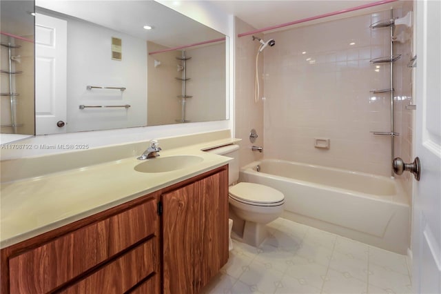 full bathroom featuring vanity, toilet, and tiled shower / bath combo