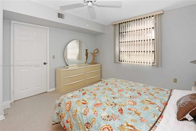 bedroom featuring light colored carpet and ceiling fan