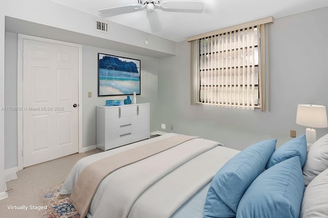 carpeted bedroom with ceiling fan