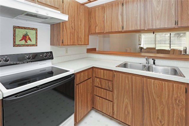 kitchen with range with electric cooktop and sink