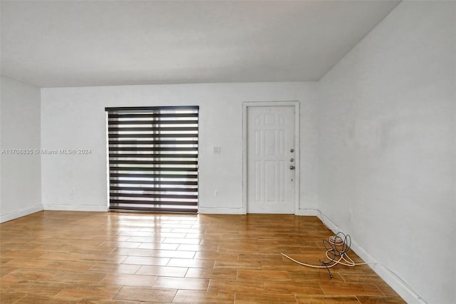 empty room with light hardwood / wood-style floors