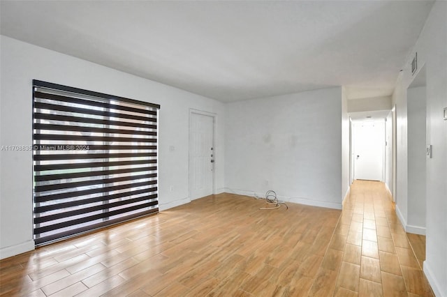 spare room with light hardwood / wood-style flooring