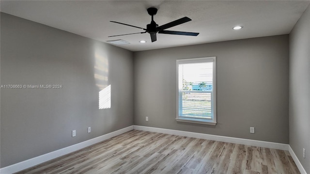 unfurnished room with light hardwood / wood-style floors and ceiling fan