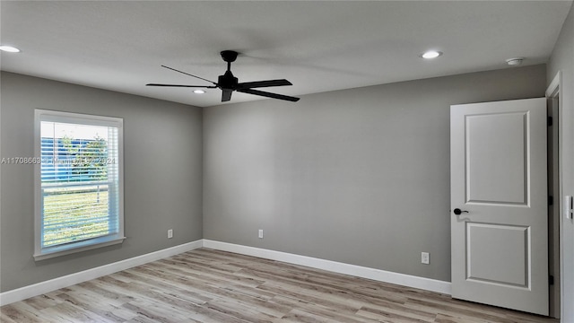 empty room featuring light hardwood / wood-style flooring and ceiling fan