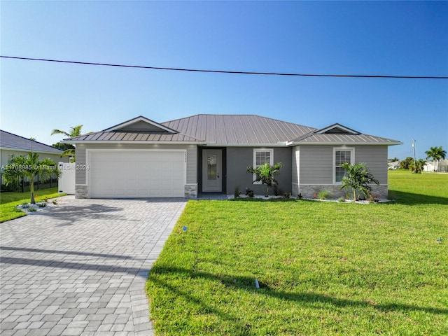 single story home with a garage and a front yard