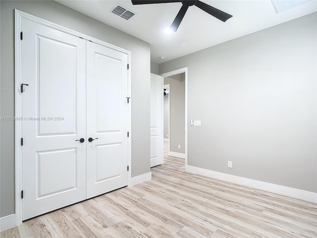 unfurnished bedroom featuring a closet, ceiling fan, and light hardwood / wood-style flooring