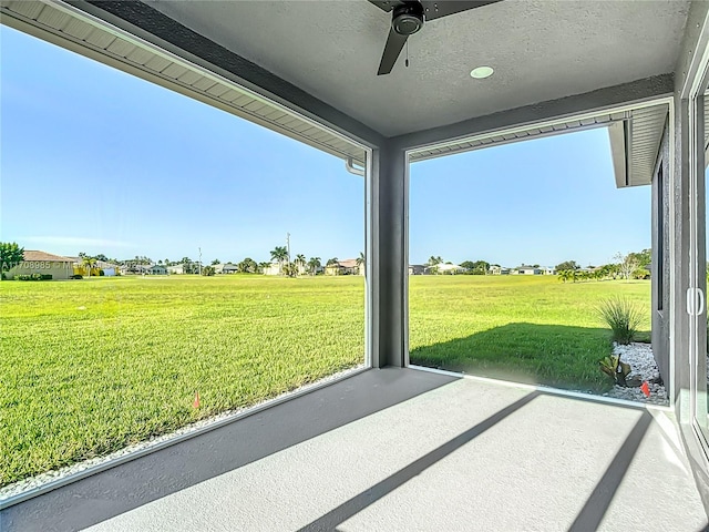 exterior space featuring ceiling fan