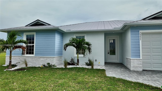 exterior space with a front lawn and a garage