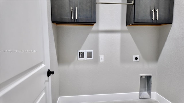 washroom with hookup for an electric dryer, cabinets, and hookup for a washing machine