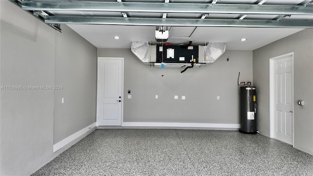 garage with a garage door opener and water heater