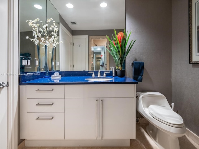 bathroom with vanity and toilet