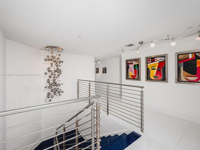 staircase with tile patterned floors