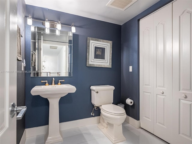 bathroom with tile patterned floors and toilet